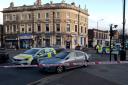 Police have been seen at the scene of a crash just outside Manor Park Library