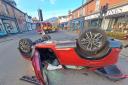 CRASH: The aftermath of the crash in Malvern Link which caused a car flipped on its roof