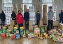 Capital Kids Cricket staff and volunteers with food items to be delivered to families in need in Newham.