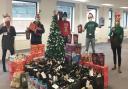 Thames Water volunteers Jane Cripps, Ray Lagden, Dave McLaren, Christian Squibb and Jackie Westgate with some of the treats for the care packages.