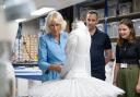 Queen Camilla looks at ballet costumes being made