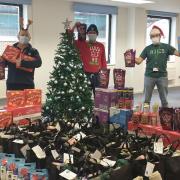 Thames Water volunteers Jane Cripps, Ray Lagden, Dave McLaren, Christian Squibb and Jackie Westgate with some of the treats for the care packages.