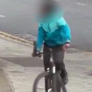 A man has been arrested after a video emerged appearing to show a cyclist wielding a large knife