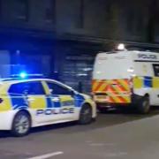 Police vehicles were seen in Duckett Street