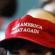 Two American passengers have been removed from a London Heathrow plane after a fight broke out over them wearing Trump MAGA hats.